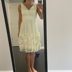 Classy white cocktail dress. Great for a bride